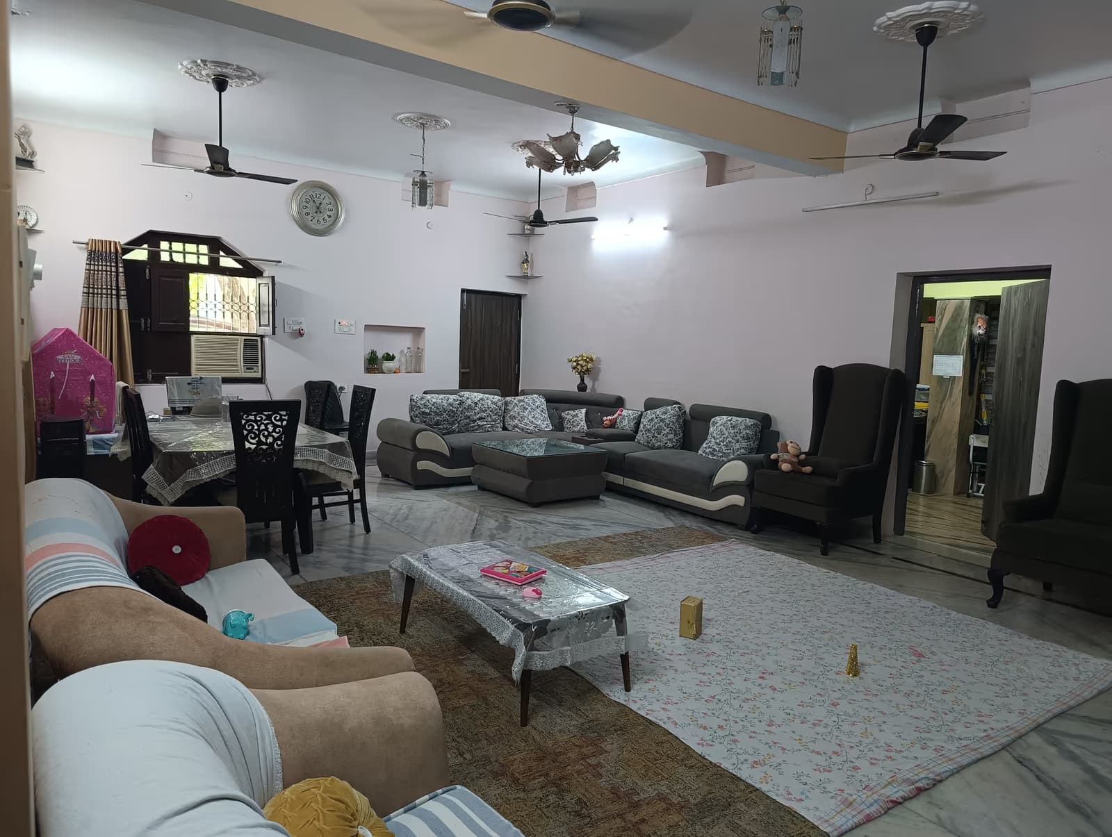 Completed family living room interior with marble flooring by MakeHouse in Patna, Bihar